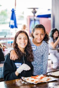 Mentees Alexis and Sammy bond as a part of the Walk With Sally community during this Friendship Activity in El Segundo near Los Angeles